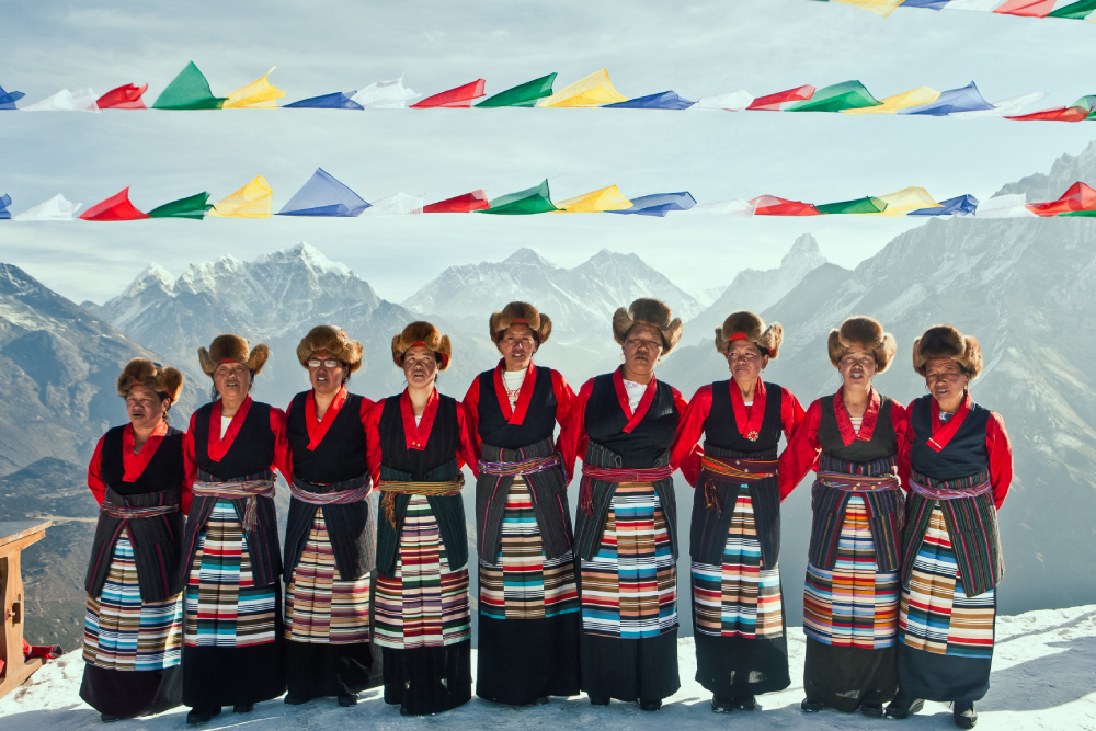 sherpa women dance in cultural attire in kongde village