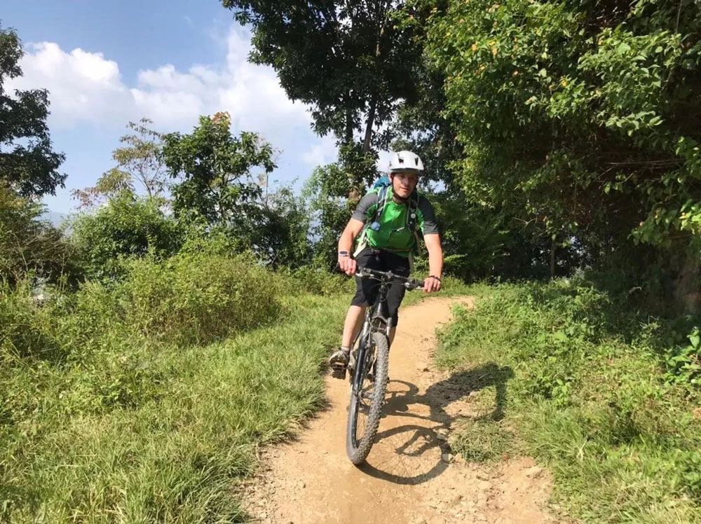 Cycling Under Lush Green Forrest